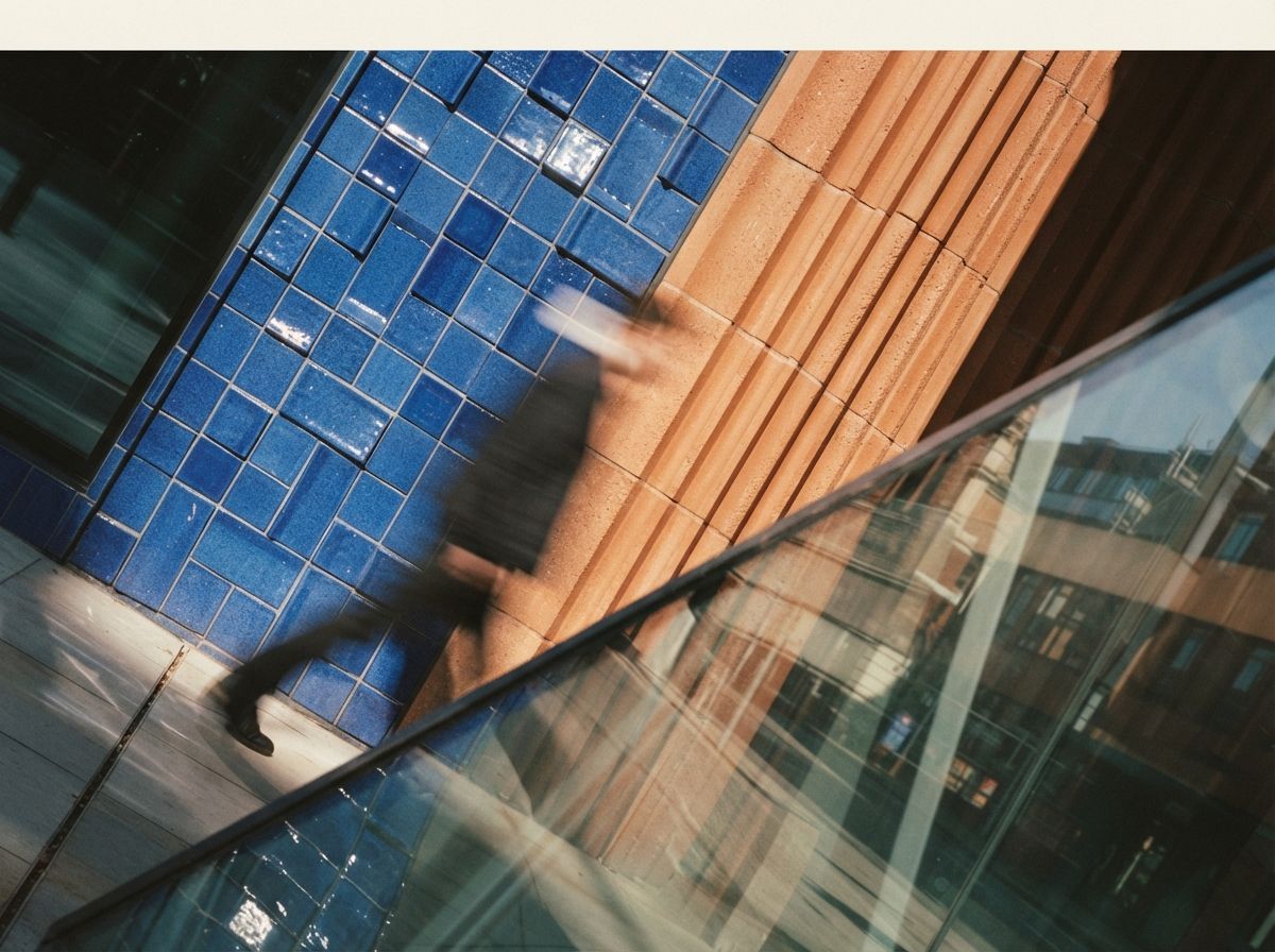 Extreme macro view of bright cobalt blue and terracotta architectural facade materials.